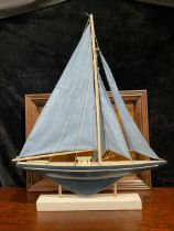 A model pond yacht, on stand; a butler's gallery tray (2)