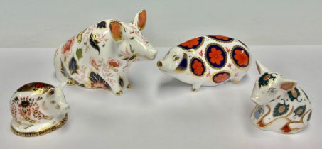 A Royal Crown Derby Paperweight, Sitting Pig, 10cm tall, gold stopper, red printed marks and Royal