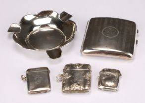 A George V silver rounded rectangular cigarette case, engine turned, monogrammed and dated 1918,