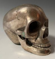 Memento Mori - a cast metal model of a human skull, with articulated lower jaw, 9.5cm high