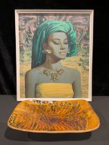 After Tretchikoff, Balinese Girl, 1969, a framed print; a mid 20th century slip glazed earthenware