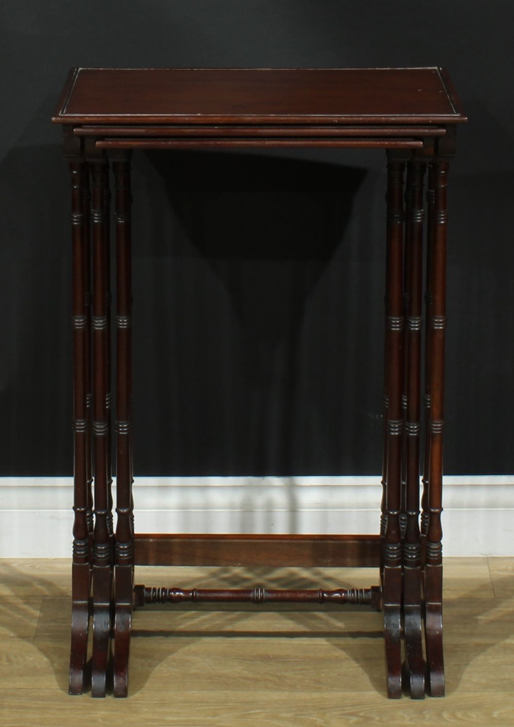 A nest of three George III Revival mahogany occasional tables, each with a rectangular top, turned - Image 2 of 5