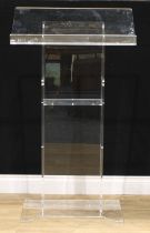 A clear Perspex portable lectern, with pair of oval carry handles, 120cm high, 68.5cm wide