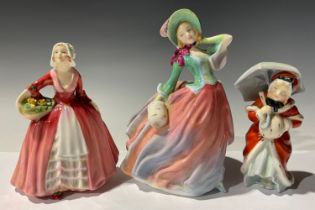 A Roal Doulton figure, Autumn Breezes; others Janet and Miss Muffet