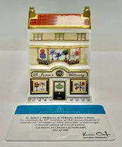 A Royal Crown Derby miniature model house, St James’s Millinery and Military Tailors, celebrating
