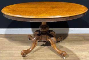 A Victorian walnut centre table, quarter-veneered tilting top, cabriole legs, ceramic casters,