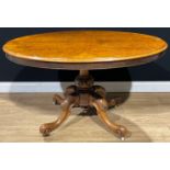 A Victorian walnut centre table, quarter-veneered tilting top, cabriole legs, ceramic casters,