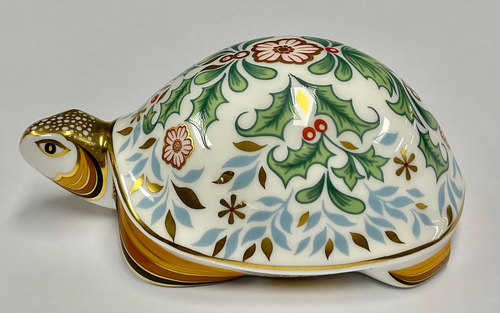 A Royal Crown Derby paperweight, Winter Tortoise, adorned with winter inspired design and