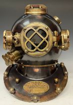 A reproduction divers helmet, brass fittings and plaque marked US Navy Diving Helmet, Mark IV,