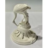 A Nymphenburg model of a crane, glazed throughout in gloss white, 11cm, impressed mark