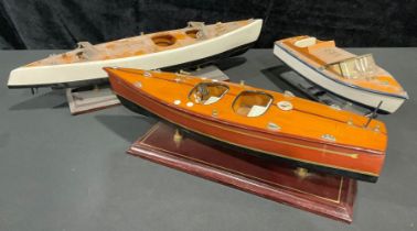 Three model speedboats