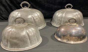 A set of three late 19th century pewter graduated lobed meat domes, scroll handles, James Dixon &