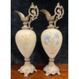 A pair of Victorian porcelain ewers, with gilt metal mounts