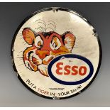 A reproduction enamelled circular advertising sign, Esso, Put A Tiger In Your Tank, approx. 30.5cm