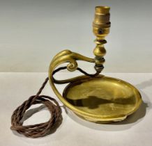 An Art Nouveau brass lamp