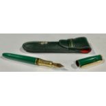 A Michel Jordi fountain pen, green leather case