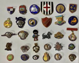 A collection of thirty enamel badges