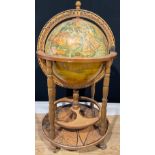 A 20th century Italian style liquor cabinet in the form of a globe, standing on four turned wooden