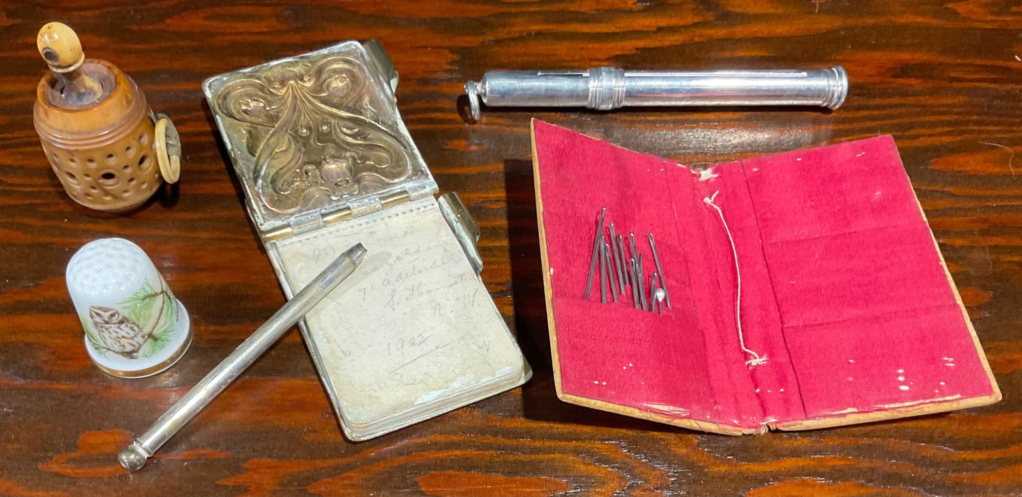 A Mauchline ware boxwood needle book, printed with St Jude's Church, South Sea and the Pier, South