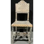 A William and Mary revival side chair, leather back and seat, rosette embossing, brass studs,