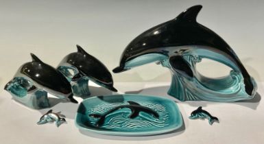 Studio Pottery - a graduated set of three Poole Pottery dolphins, the largest 19cm high, 28cm