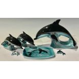 Studio Pottery - a graduated set of three Poole Pottery dolphins, the largest 19cm high, 28cm