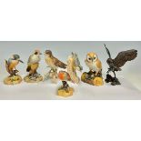 A Royal Crown Derby model, of a Barn Owl, 14cm high; others, Kingfisher, Woodpecker, Robin; a Goebel