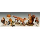 A Royal Doulton model, of a spaniel with a pheasant, 13.5cm high; another; a Royal Worcester