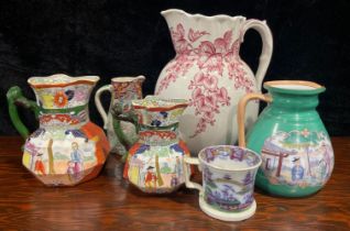 A large Victorian jug; two Masons Ironstone jugs; a Chinese panel jug; a jug and mug
