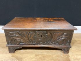 A 17th century style oak coffer bach, 63cm wide