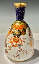 A Derby Crown Porcelain Company Imari bottle vase, printed and painted with scrolls and flowers,