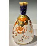 A Derby Crown Porcelain Company Imari bottle vase, printed and painted with scrolls and flowers,