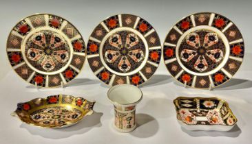 A set of three Royal Crown Derby Imari 1128 pattern tea plates; a shaped oval trinket tray with