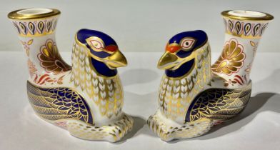A pair of Royal Crown Derby Griffin candle holders, 12cm long, first quality, printed marks in red