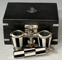 A pair of contemporary opera glasses, chequered pattern, in metal bound box