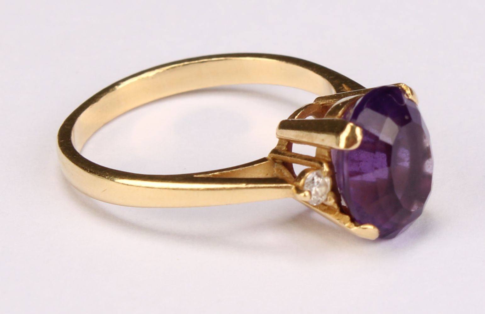 An 18ct gold amethyst and diamond ring, size N/O, Sheffield 1994, 3.8g