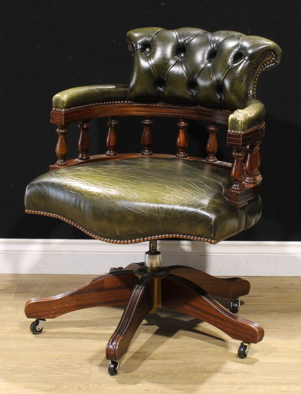 A Victorian style Chesterfield swivel office chair, 86.5cm high, 63cm wide, the seat 52cm wide and