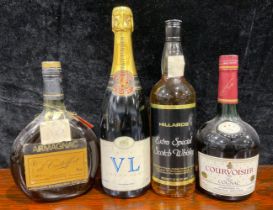 A bottle of Courvoisier Cognac; others, De Castelfort Armagnac; Hillards Scotch; Tattinger Brut