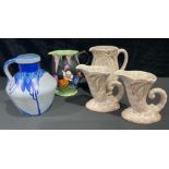 A Phoenixware Art Deco jug; a Falconware jug; a Beswick jug; a pair of vases