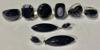A blue sterling silver blue goldstone fashion ring, canted rectangular stone, size T; five other
