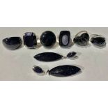 A blue sterling silver blue goldstone fashion ring, canted rectangular stone, size T; five other