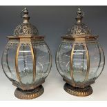 A pair of copper coloured metal lanterns, of bulbus octagonal form, with decoration in relief,