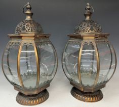 A pair of copper coloured metal lanterns, of bulbus octagonal form, with decoration in relief,