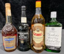 A bottle of Grant's Scotch whisky, 75cl; others, Cockburn's Port; Martell fine Cognac; Gordon's