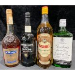 A bottle of Grant's Scotch whisky, 75cl; others, Cockburn's Port; Martell fine Cognac; Gordon's