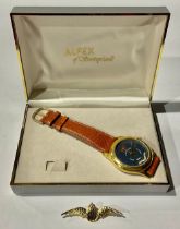 An Alfex of Switzerland Royal Air Force wristwatch, leather strap; a Royal Air Force brooch, with