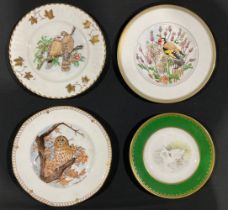 A hand painted plate, decorated by J McLaughlin, signed, the central field with a swan and