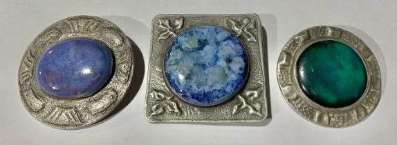 Three Arts and Crafts pewter brooches, set with Ruskin plaques