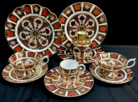 Royal Crown Derby 1128 Imari comprising, a pair of plates, one frilled edged plate, two tea cups and
