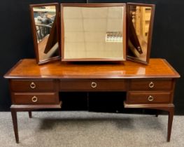 A Stag mahogany dressing table, triple mirror, arrangement of five drawers to base, 128cm high x